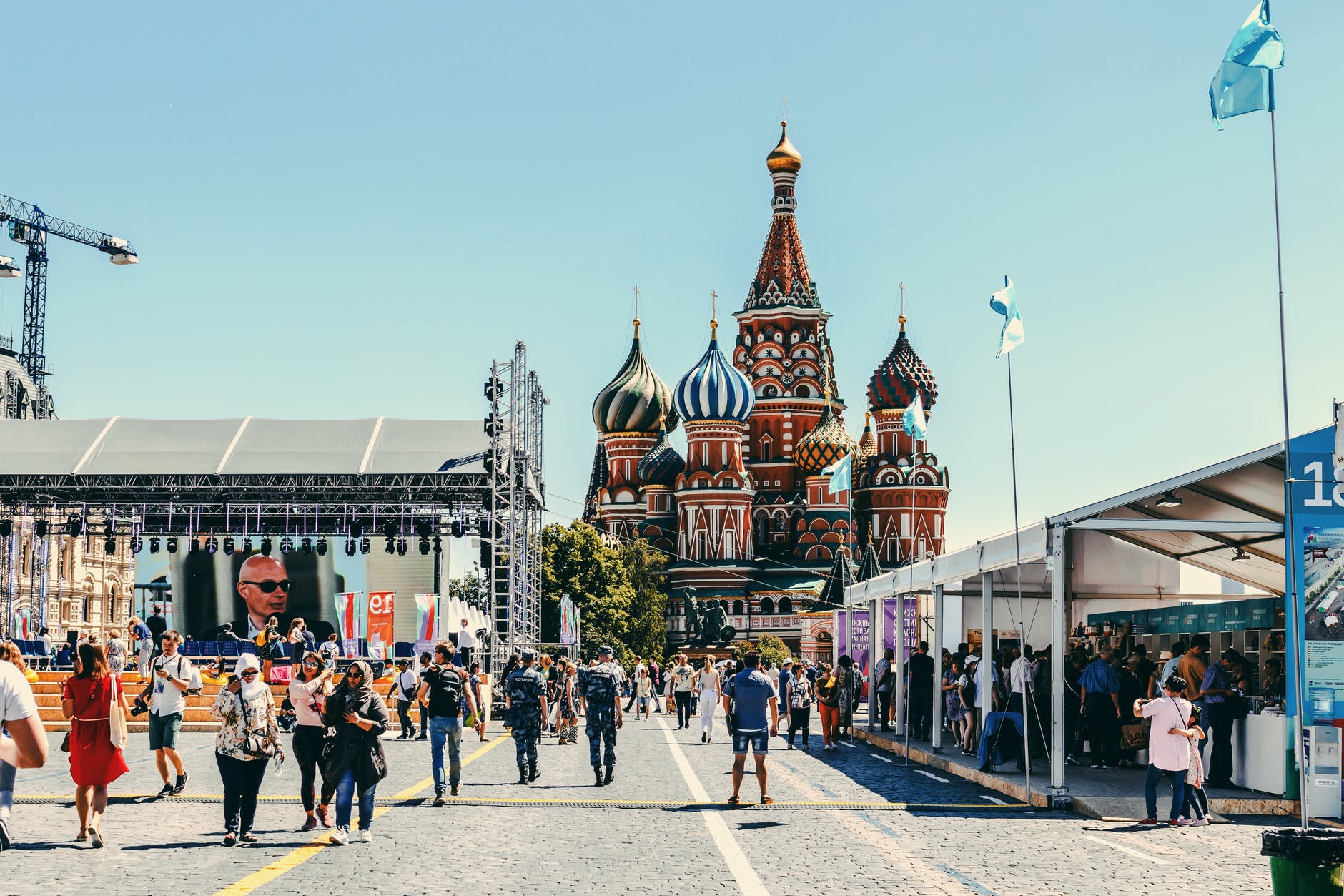 people walking near st basil s cathedral in moscow russia